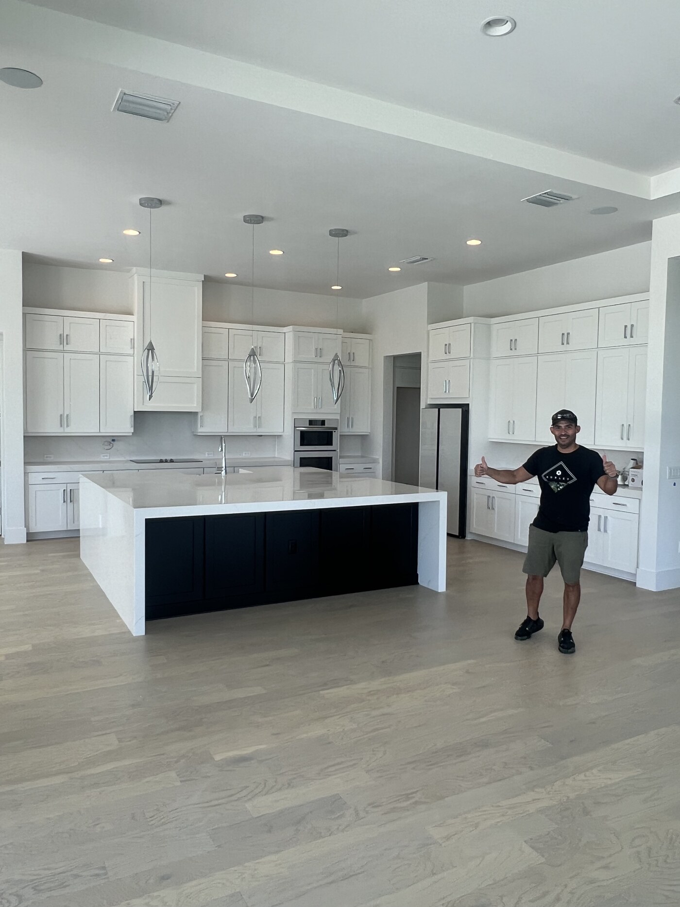 Alberto, founder of Madecoga, in a completed custom kitchen in Orlando